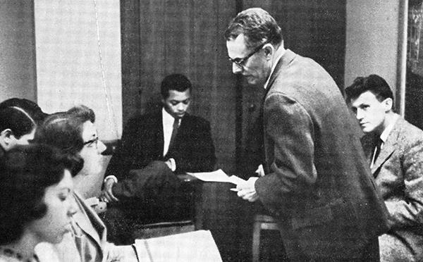 man teaching students in classroom